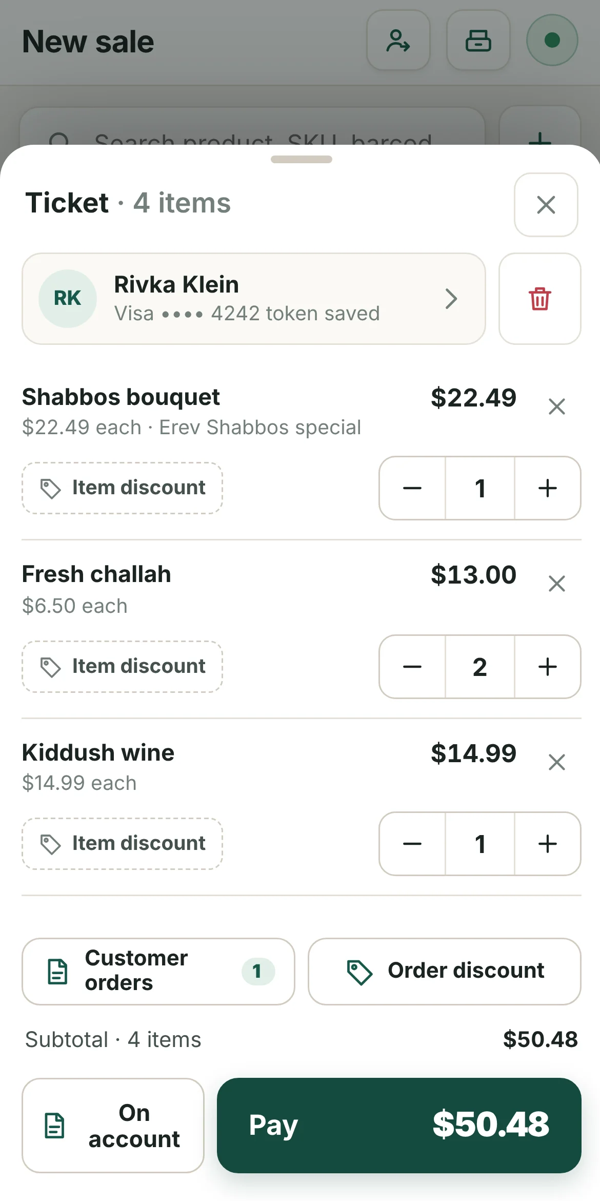 The same POS on an iPhone: the open ticket with quantities, discounts and Pay